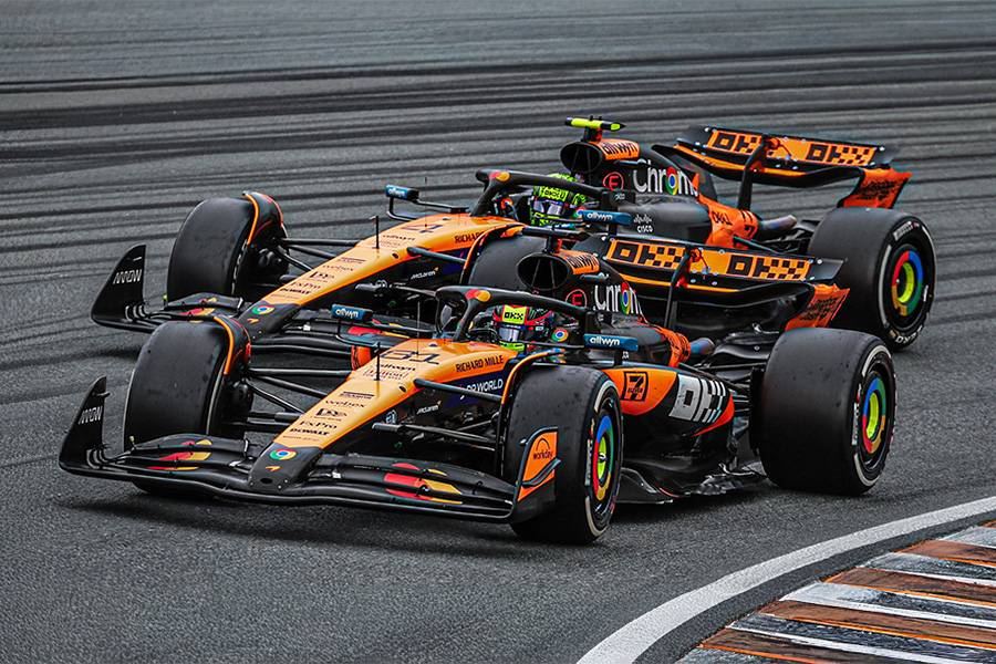 Deux McLaren, deux visages : Lando Norris et Oscar Piastri. Eux traquent les centièmes ; AkzoNobel fournit la surface — fonction au micromètre, vitesse à la seconde.